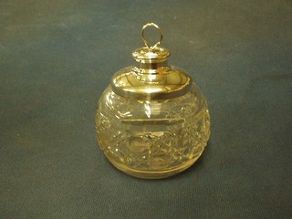 A globular shaped cut glass perfume bottle with silver mounts London 1928