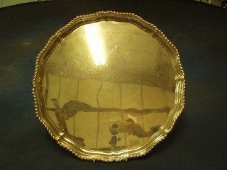 A handsome circular silver  salver with bracketed and gadrooned border, raised on 4 scroll feet Birmingham 1943, 54 ozs
