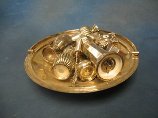 A circular silver plated cake basket with spring handle, a pepper grinder and other silver plated items etc