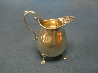 A silver cream jug Birmingham 1933 (some dents and creases) 2 ozs