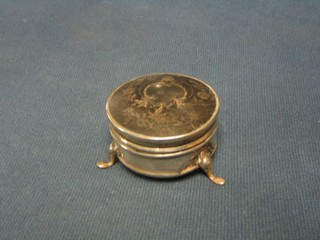 A circular silver and tortoiseshell mounted trinket box with hinged lid raised on 3 hoof supports 2"