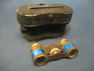 A pair of gilt metal and enamelled opera glasses and 1 other pair of opera glasses