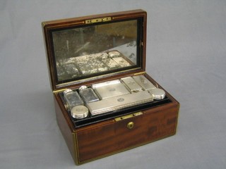 A handsome Victorian mahogany and brass banded vanity box with hinged lid, the lid fitted a mirror and with 2 rectangular cut glass scent bottles, 2 round scent bottles, pin tray and lid, rectangular cut glass box (slight chip), 2 small rectangular cut glass jars with engraved lids, all with engine turned lids and armorial decoration, London 1848, together with a leather blotter, marked Edwards Manufacturers to Her Majesty, 21 Kings Street, Bloomsbury, London