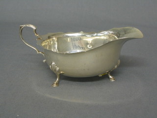 A Georgian style silver cream jug with cut border, by Walker & Hall with Jubilee mark, Birmingham 1934, 3 ozs