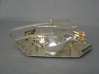 A silver plated asparagus tray complete with sauce boat and tongs by Harrods