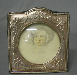 A 19th Century gilt metal trinket box of shaped form with hinged lid, the lid inset a print of a bonnetted lady 4"