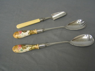 A 19th Century silver plated stilton scoop and pair of silver plated salad servers with porcelain handles
