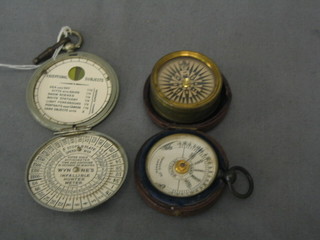 A brass compass 1 1/2", a damp/dry detector together with Wynnes Infallible hunter exposure meter