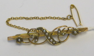 A 9ct gold bar brooch set demi-pearls