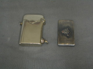 A Thorns Swiss Made British patent chromium plated cased cigarette lighter, together with a metal money clip decorated the crest of the Royal Artillery Association
