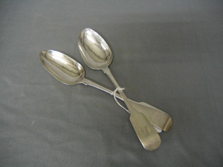 A pair of George III silver fiddle pattern table spoons Dublin 1809 with armorial decoration 4 ozs