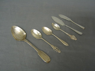 A Victorian Scots silver fiddle pattern pudding spoon Edinburgh, 2 silver butter knives, 2 Edward VIII silver coronation tea spoons and 1 other