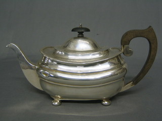 An oval Georgian style silver teapot with rope edge border and bun feet, Birmingham 1923 (marks rubbed), 21 ozs