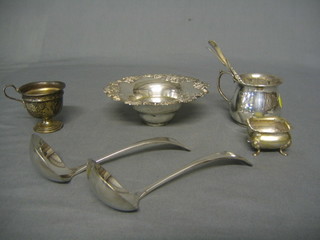 A miniature silver  cup 2", a circular silver plated strainer, 2 silver plated ladles