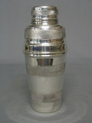 A silver cocktail shaker, Sheffield 1934 with engine turned decoration 16ozs