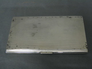 A silver cigarette case with engine turned decoration Birmingham 1923 7 ozs