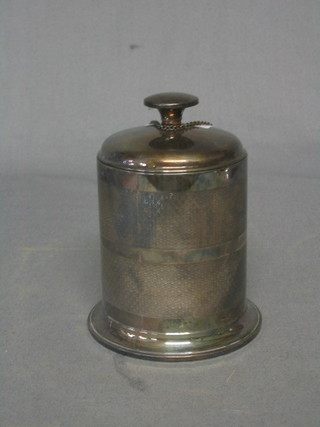 An Art Deco cylindrical silver plated cigarette dispenser, a silver plated sherry decanter label and a small enclosed ashtray