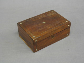 A Victorian rosewood trinket box with hinged lid and mother of pearl line inlay (some damage to the sides) 9" containing a collection of various prayer books 10"