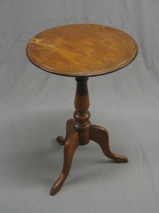 A Victorian circular mahogany wine table raised on a turned column, increased in height from 2 separate tables, (with water stain to the top) 19"