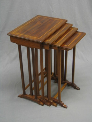 A quartetto of inlaid mahogany interfitting coffee tables (some contact marks)