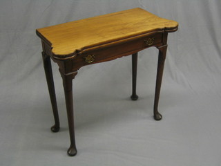 A part Georgian bleached mahogany card table of shaped outline fitted a drawer, raised on club supports (small section of timber missing from top right hand corner by hinge and replacement handles to drawer) 32"