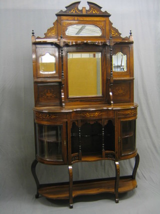 A Victorian inlaid rosewood chiffonier display stand of serpentine outline, the raised back fitted 3 shelves with triple plate mirrors, the base fitted a recess flanked by a pair of bow front panelled cupboards, with an undertier and raised on cabriole supports 45" (missing section of veneer to right hand upright)