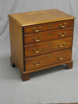 A handsome Georgian mahogany chest of 4 long graduated drawers with original brass swan neck drop handles, raised on bracket feet, 30"