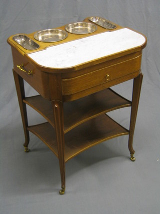 A 20th Century French walnut shaped 3 tier wash stand with marble top, the interior fitted 4 circular silver plated trays, raised on French cabriole supports by Ander Faye, 24" (slight chip to marble)