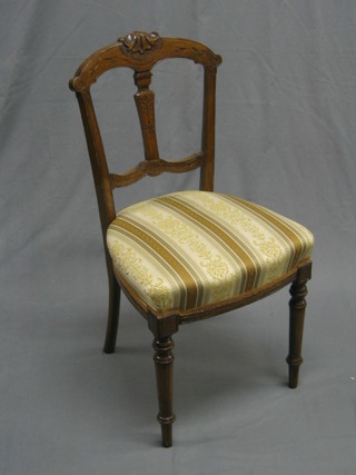 An Edwardian inlaid mahogany bar back dining chair with carved splat back and upholstered seat, raised on turned supports