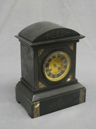 A Victorian French 8 day striking mantel clock with Roman numerals contained in a black marble case