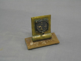 A WWII air ministry air craft clock, the circular dial with Arabic numerals, the base marked AM 106A/322, 8174/41