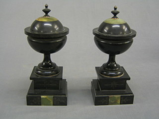 A pair of Victorian marble lidded urns, raised on stepped bases 6"