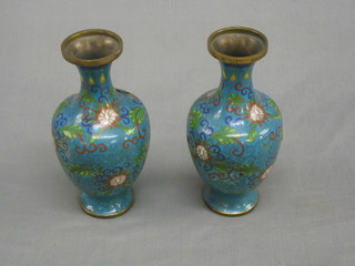 A pair of 20th Century blue ground Cloisonne enamelled vases (1 dented), 8"