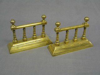 A pair of 19th Century heavy brass fire dogs