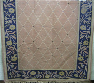 A blue and pink floral patterned carpet (slight stain to corner) 130" x 94" (some wear)
