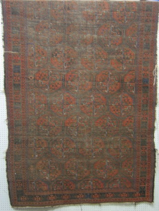An Afghan rug with multiple octagons to the centre within multi-row borders 97" x 54" (in wear)