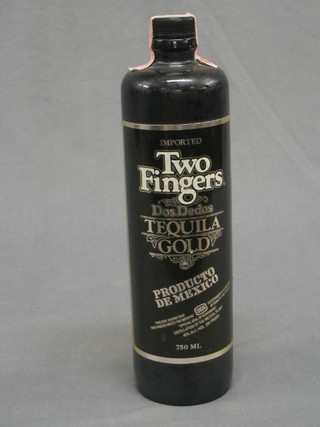 A bottle of Two Fingers Tequila Gold