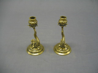 A pair of Venetian brass candle sticks in the form of dolphins, bases marked Made in Venice 8"