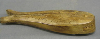 A pair of carved wooden nut crackers in the form of fish 9"