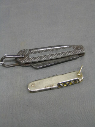 A Naval Issue steel bladed jack knife and a multi bladed jack knife