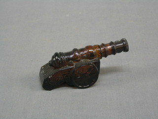 A bottle of Avon "Wild Country" after shave in the form of a Siege Cannon 