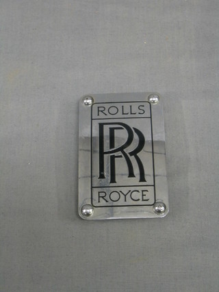 A Rolls Royce metal plaque removed from a modern Rolls Royce, the reverse marked RK 18357, 4"