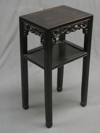 An Oriental hardwood 2 tier occasional table, 16"