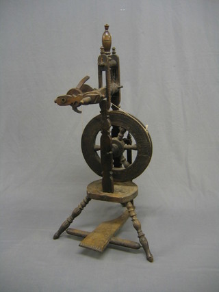 An 18th/19th Century European carved wooden spinning wheel