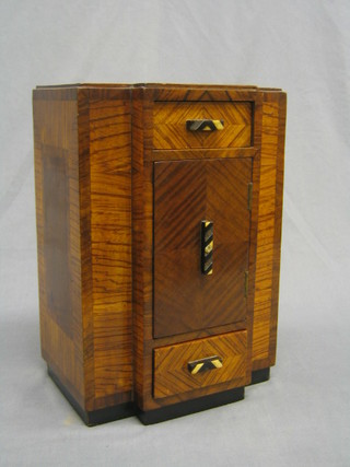 An Art Deco parquetry and walnut apprentice style tall boy fitted 1 short drawer above a cupboard, the base fitted a drawer 9" (missing small section of beading to top right hand corner, light scratch to the base and some inlaid missing from handles)