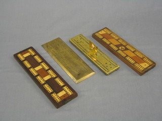 2 brass cribbage boards and 2 wooden cribbage boards