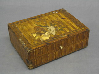 A 19th Century parquetry trinket box decorated flowers with ivory handle and bun feet 8 1/2"