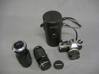 An Olympus camera and 2 lenses