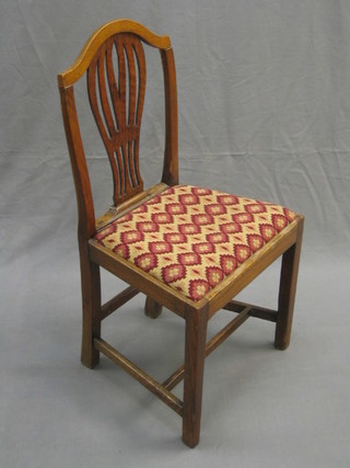 A 19th Century Country  honey oak Hepplewhite style camel back dining chair with pierced splat back and upholstered drop in seat, raised on square tapering supports