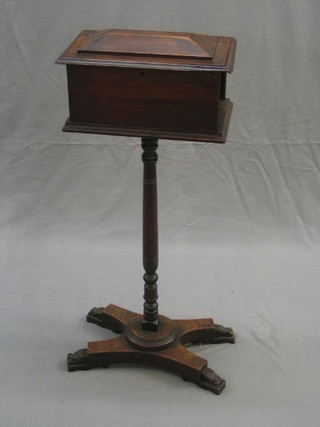 A Victorian pine teapoy of sarcophagus form with hinged lid, raised on a turned column with triform base 15" (3" of moulding missing to lid)